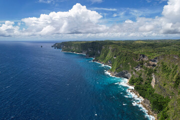 Aerial view of South Shore (Guyangan Waterfall) from above Manta Cliff on sunny day. Nusa Penida Island, Indonesia.