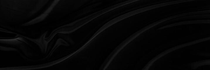 Black gray satin dark fabric texture luxurious shiny that is abstract silk cloth panorama background with patterns soft waves blur beautiful.