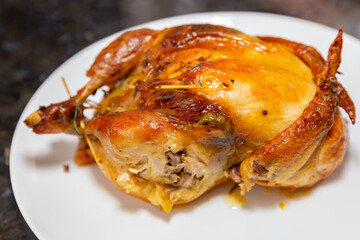Traditional homemade roast chicken, stuffed with farofa
