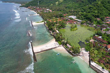 Aerial view of Candidasa Beach and Lotus Logoon on sunny day. Bali, Indonesia.