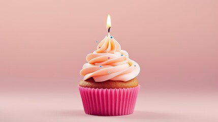  a cupcake with a single candle on top of it, sitting on a pink surface The cupcake is a light pink color and the candle is lit, casting a warm glow on the cupcake