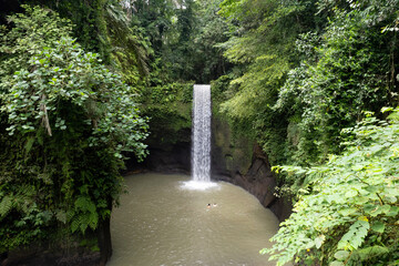 View of Tibumana Waterfall on cloudy day. Bali, Indonesia.