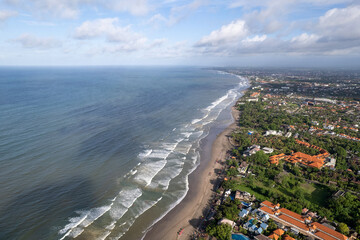 Aerial view of Seminyak Beach on sunny day. Bali, Indonesia.