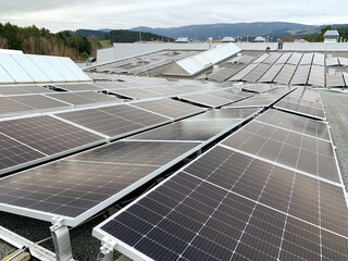 Solar panels on the rooftop of a house, using renewable energy in modern buildings