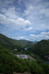 Fototapeta na wymiar Green natural and clear sky at Khuean Srinagarindra, Srinakarin Dam, Thailand