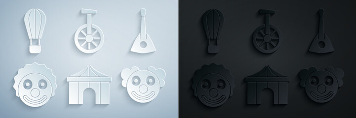 Set Circus tent, Balalaika, Clown head, Unicycle or one wheel bicycle and Hot air balloon icon. Vector © Oksana