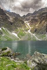 Morskie oko pond, view of the water surface and rocks - obrazy, fototapety, plakaty