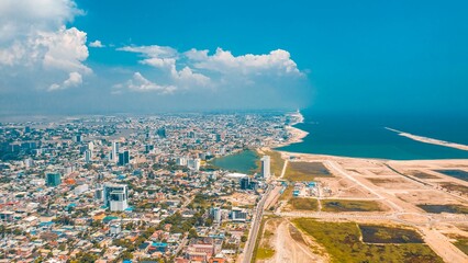 Aerial view of Lagos cityscape before the sea on a sunny day - obrazy, fototapety, plakaty