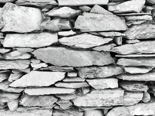 Grayscale of the texture of a wall made with wood
