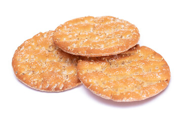 A Heap of Round Salt Crackers with Sesame Isolated on White Background. Dry Snacks - Isolation