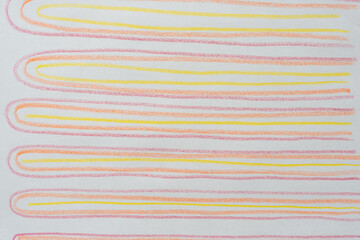 mostly yellow, orange, and red looping lines (horizontally) on blank paper