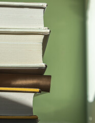 Morning sunlight shinning on a stack of books. Concept of lifestyles. 
