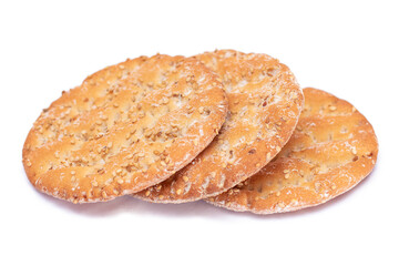 A Heap of Round Salt Crackers with Sesame Isolated on White Background. Dry Snacks - Isolation