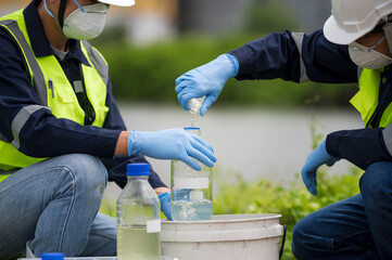 Saving earth. Environmental researchers investigate the condition of canal water for toxic spill,...