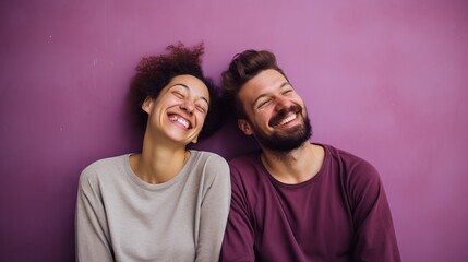 Obraz premium Couple Expressing Amuse Emotions Against a Purple Gradient Background