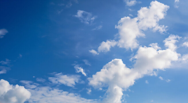 Fluffy soft clouds. Beautiful cloudy sky. Dream cloud of heaven. Nature background or backdrop.