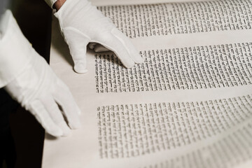 Rabbi with jewish hebrew bible is praying for Israel. Purim celebration. Rabbin is reading Tanakh...