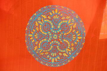 Mandala coloring on cloths. Abstract background with ornament mandala design.