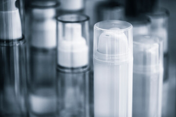 Close up of a white plastic spray bottle for cosmetics, plastic packaging industry concept background