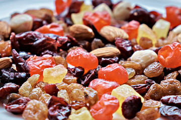 Various dried fruits and nuts on a white background. Selective focus.