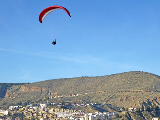 Paraglider landing at Cenes de la Vega in Spain