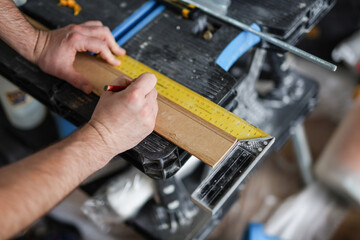 Measure wooden elements in the garage