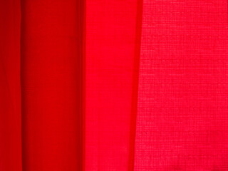 Close-up image of red curtains.