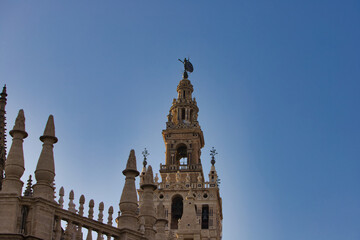 Fototapeta premium Cathedral of Santa Maria de la Sede with Giralda in Seville, Spain. Travel and tourism concept. Catholicism and monuments.