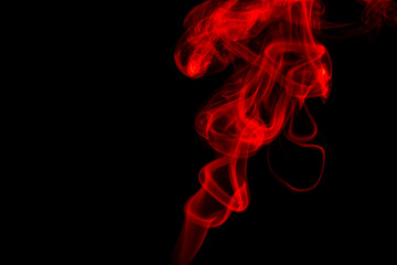 Obraz premium red Smoke Cigarette in Dark Background
