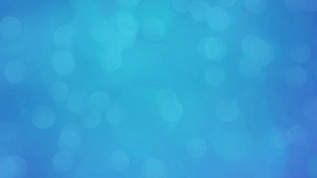 Abstract blue glittering circle background with bokeh. Blue Bokeh Motion Background.