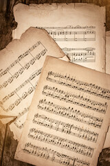 Old Music Sheets On Wooden Background