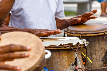 Percussionists playing their instruments during a capoeira performance in a Pelourinho square in...