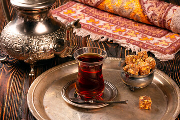 Turkish delight sweets on plate with Turkish tea.