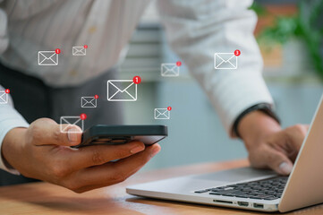 Businessman using email on smartphone with notification alerts for business email online communication and digital marketing. Email notifications in your inbox