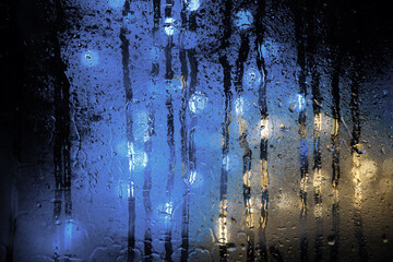 Background of misted glass. Christmas lights