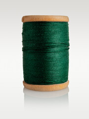 ball of thread, spool of sewing thread and needle isolated on white background