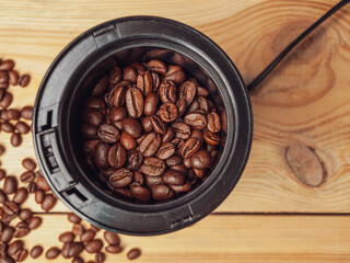 Electric coffee grinder for grinding coffee beans and preparing a coffee drink