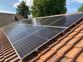Close up of solar panels on roof home - obrazy, fototapety, plakaty