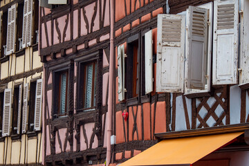 Obraz premium Moving through the colorful half timbered building in the streets of the beautiful Alsace village Riquewihr