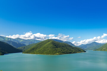 Georgia's Zhinvali Reservoir: A Visual Symphony of Lakeside Splendor and Majestic Caucasus lake in the mountains