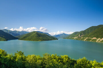 Georgia's Zhinvali Reservoir: A Visual Symphony of Lakeside Splendor and Majestic Caucasus lake in the mountains
