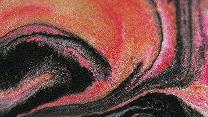 Fluid art. Glitter paint flow. Golden black pink color sparkling wet metallic ink blend swirl on...