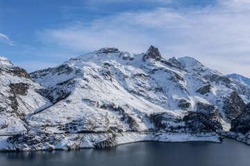Fototapeta na wymiar Lake surrounded by snowy mountains