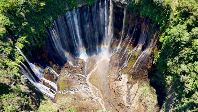 Aerial 4K close up footage of Tumpak Sewu also known as Coban Sewu waterfall. A jungle waterfall in East Java,  Indonesia