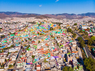 Fototapeta na wymiar Colorful buildings in Cubitos district in Pachuca, Hidalgo state, Mexico. Grand Mural - the biggest Mural in the World