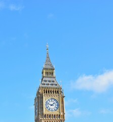 Stunning view of the iconic Big Ben clock tower in London, England in blue sky background