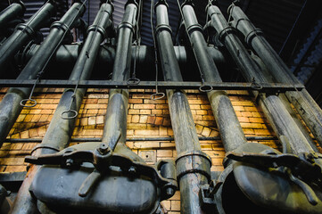 Gas retorts and chimneys on furnace at former gasworks