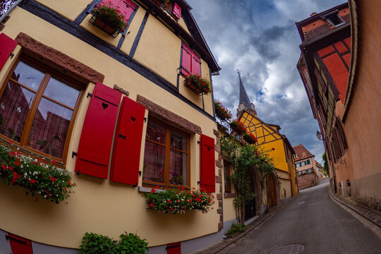 the colorful half timbered building in the streets of the beautiful Alsace village Riquewihr