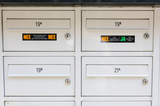 Letterboxes in Amsterdam showing the "Nee/Ya" and "Nee/Nee" stickers to limit the amount of junk mail received.