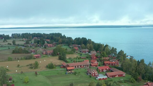Swedish countryside village red house. Foggy misty living peaceful rural life